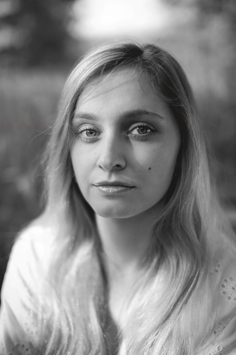 A girl sitting in the meadow