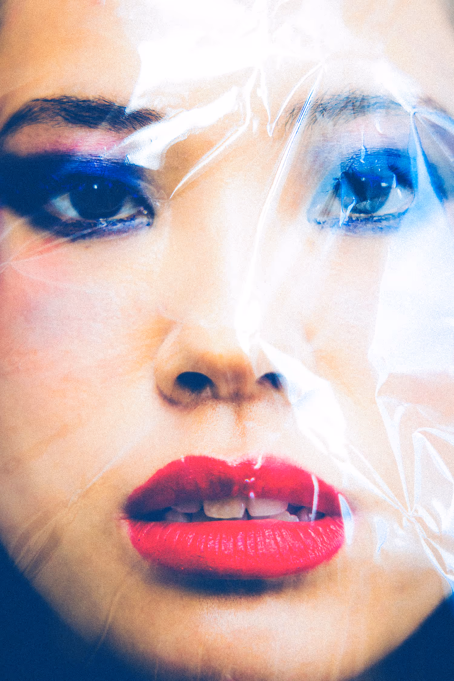 Woman’s face wrapped in plastic